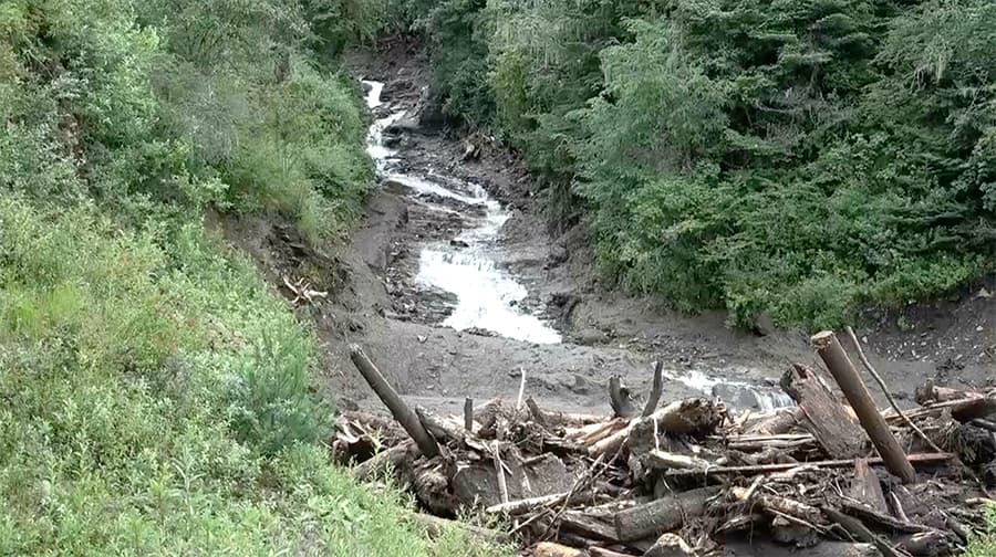 Residents rely on temporary water source after flash flood damages system